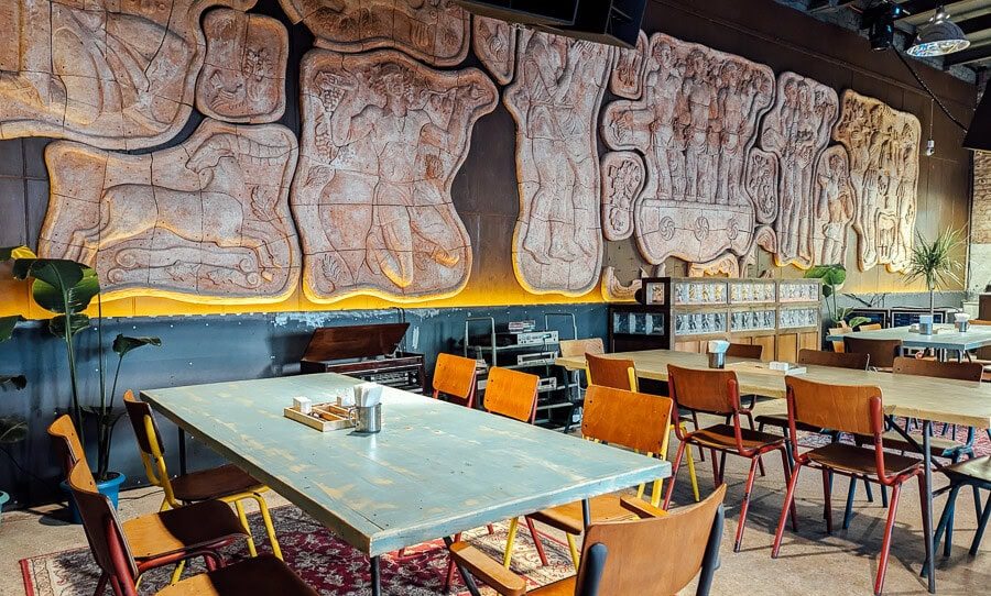 The cast bas-relief frieze along the wall of the dining hall